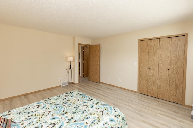 2383 58th Ave S Unit A, Fargo, ND 58104 - bedroom featuring light wood-style flooring and a closet