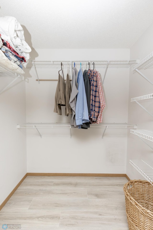 2383 58th Ave S Unit A, Fargo, ND 58104 - walk in closet featuring wood finished floors