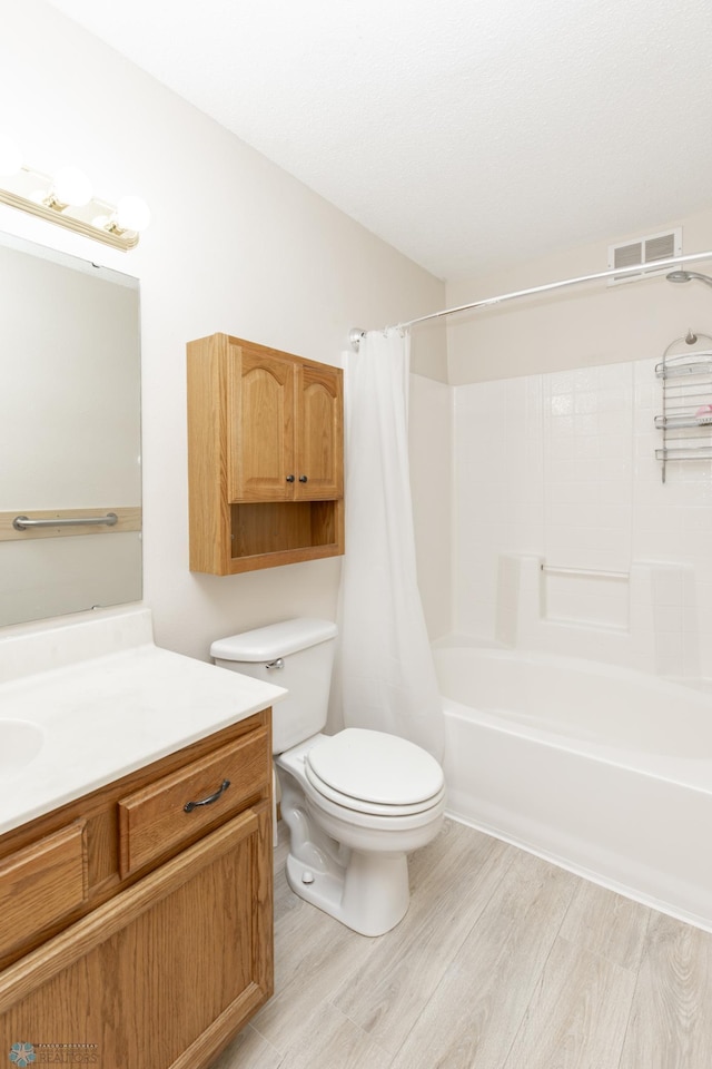 2383 58th Ave S Unit A, Fargo, ND 58104 - full bathroom with vanity, wood finished floors, and shower / tub combo with curtain