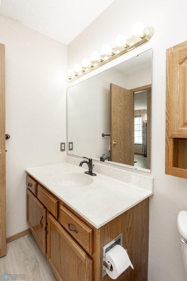 2383 58th Ave S Unit A, Fargo, ND 58104 - bathroom featuring vanity and wood finished floors