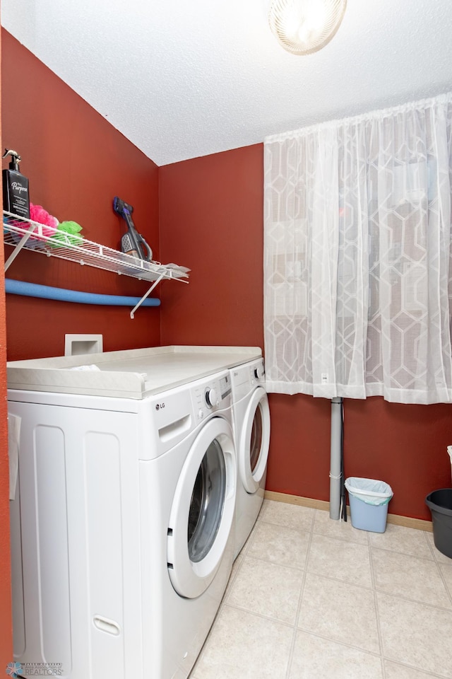 2383 58th Ave S Unit A, Fargo, ND 58104 - washroom featuring independent washer and dryer and tile patterned floors