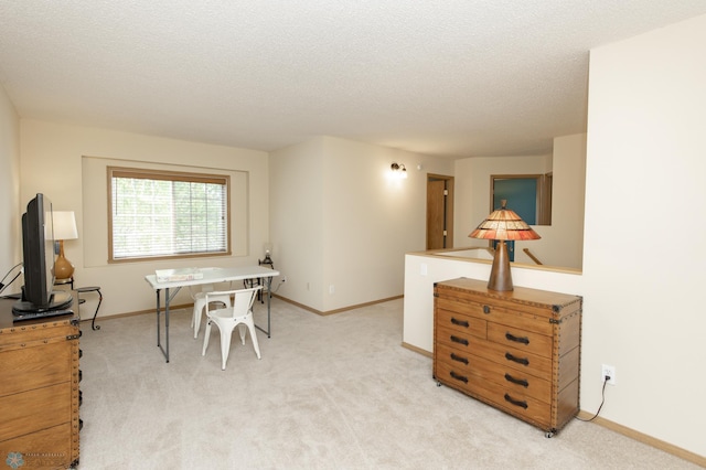 2383 58th Ave S Unit A, Fargo, ND 58104 - dining area with carpet floors and a textured ceiling