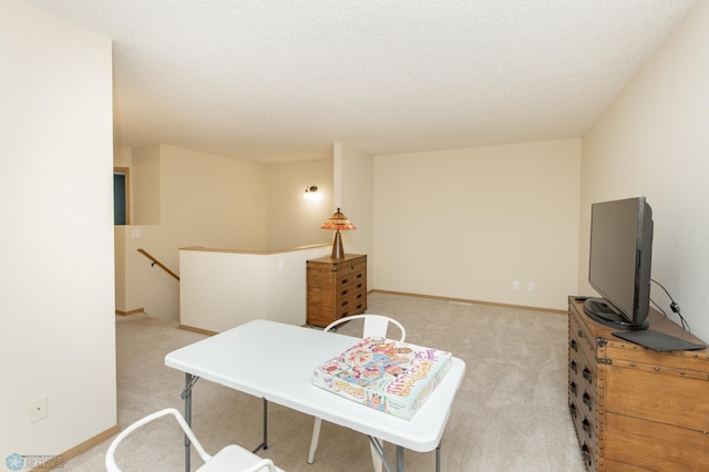 2383 58th Ave S Unit A, Fargo, ND 58104 - living area featuring light carpet and a textured ceiling