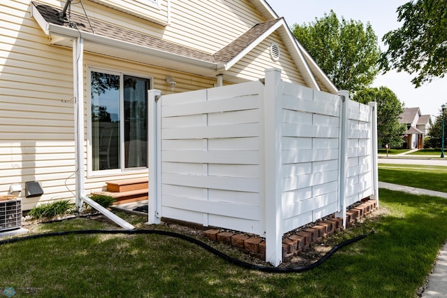 2383 58th Ave S Unit A, Fargo, ND 58104 - view of home's exterior featuring roof with shingles, a yard, and entry steps