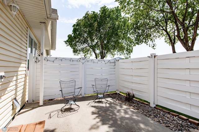 2383 58th Ave S Unit A, Fargo, ND 58104 - fenced backyard with a patio area