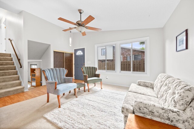 2304 Wildwood Trl, Minnetonka, MN 55305 - living area with a ceiling fan, stairs, high vaulted ceiling, and light wood-style flooring