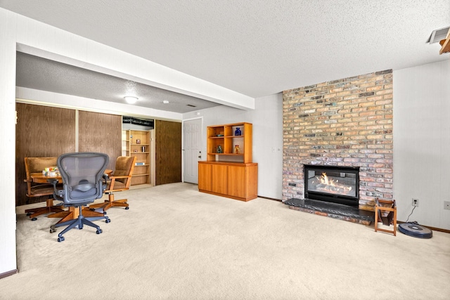2304 Wildwood Trl, Minnetonka, MN 55305 - office area with a textured ceiling, light carpet, and a brick fireplace