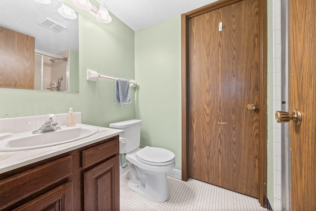 2304 Wildwood Trl, Minnetonka, MN 55305 - bathroom with vanity, a textured ceiling, tile patterned floors, and a shower with shower door