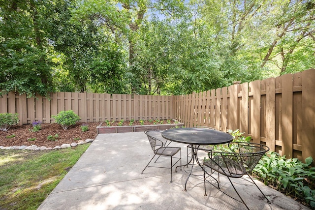 2304 Wildwood Trl, Minnetonka, MN 55305 - fenced backyard featuring outdoor dining space and a patio