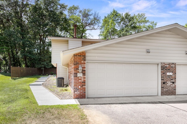 2304 Wildwood Trl, Minnetonka, MN 55305 - view of home's exterior with brick siding and a garage