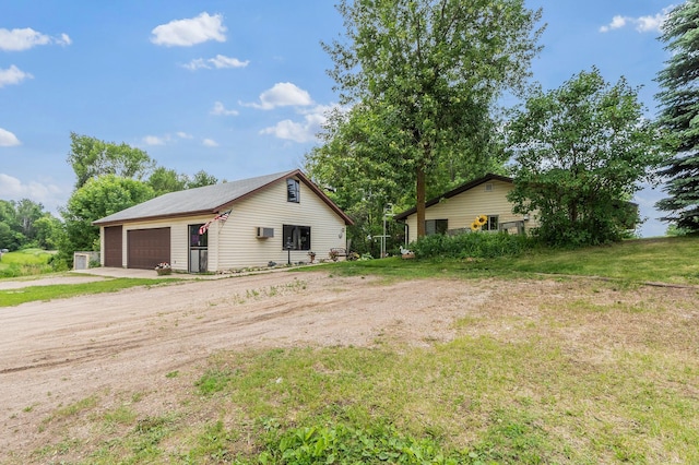 3864 Archie Dr SW, Alexandria, MN 56308 - view of front facade featuring a detached garage, an outbuilding, and driveway