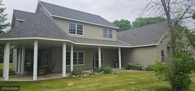 1470 Sims Rd NW, Oak Grove, MN 55011 - back of property featuring a yard, roof with shingles, and a patio