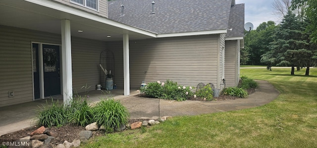 1470 Sims Rd NW, Oak Grove, MN 55011 - view of home's exterior with a shingled roof, a lawn, and a patio