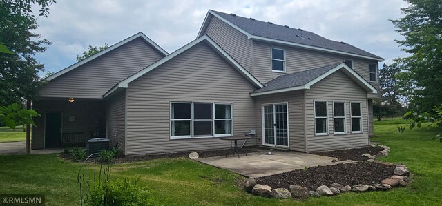 1470 Sims Rd NW, Oak Grove, MN 55011 - rear view of property featuring a patio, a yard, and a shingled roof