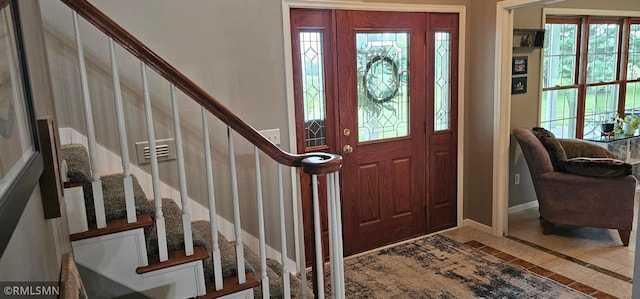 1470 Sims Rd NW, Oak Grove, MN 55011 - entrance foyer featuring inlaid floor details, plenty of natural light, and stairway