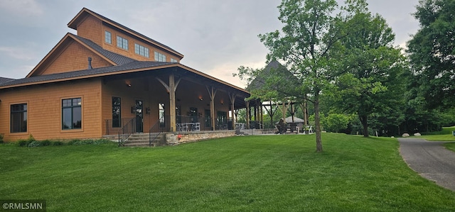 1470 Sims Rd NW, Oak Grove, MN 55011 - back of property featuring a yard and covered porch