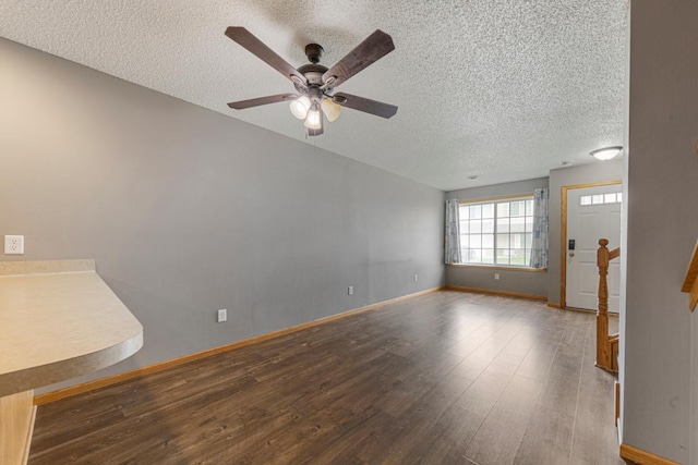 345 Roosevelt St S Unit C, Cambridge, MN 55008 - spare room with a textured ceiling, a ceiling fan, wood finished floors, and baseboards
