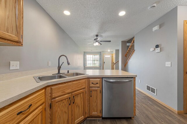 345 Roosevelt St S Unit C, Cambridge, MN 55008 - kitchen featuring stainless steel dishwasher, a sink, a textured ceiling, a peninsula, and a ceiling fan