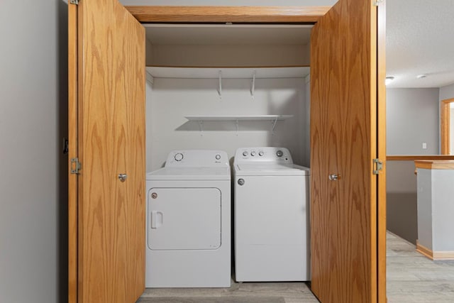 345 Roosevelt St S Unit C, Cambridge, MN 55008 - laundry area with washer and clothes dryer and light wood-type flooring
