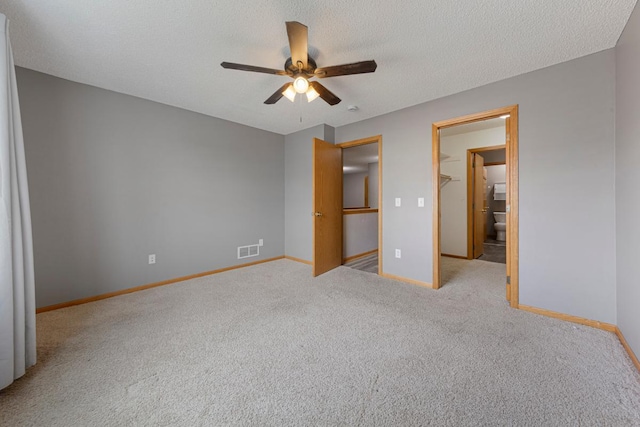 345 Roosevelt St S Unit C, Cambridge, MN 55008 - unfurnished bedroom with carpet flooring, baseboards, ceiling fan, and a textured ceiling