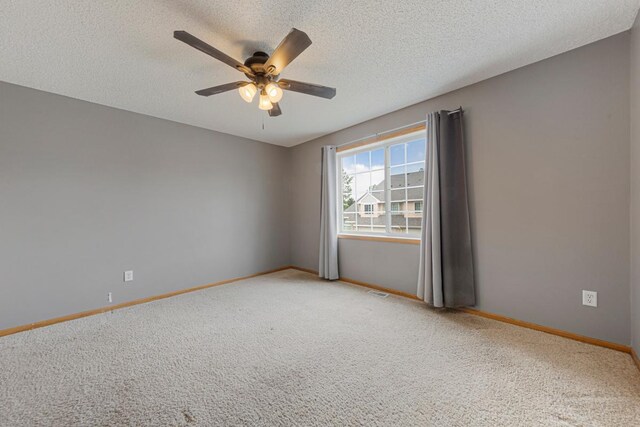345 Roosevelt St S Unit C, Cambridge, MN 55008 - unfurnished room featuring light carpet, a ceiling fan, baseboards, and a textured ceiling
