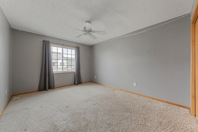 345 Roosevelt St S Unit C, Cambridge, MN 55008 - carpeted spare room featuring a ceiling fan, a textured ceiling, and baseboards