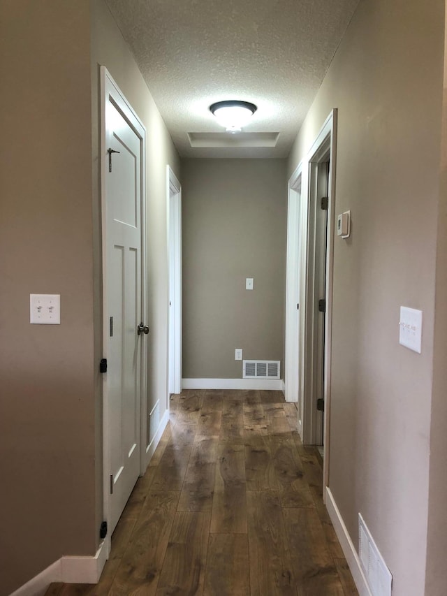 1009 188th St, Garfield Twp, WI 54009 - hallway with a textured ceiling and dark wood-style floors