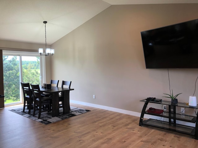1009 188th St, Garfield Twp, WI 54009 - dining room featuring vaulted ceiling, wood finished floors, and a chandelier