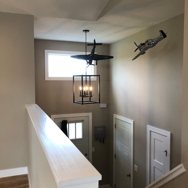 1009 188th St, Garfield Twp, WI 54009 - staircase with a chandelier and wood finished floors