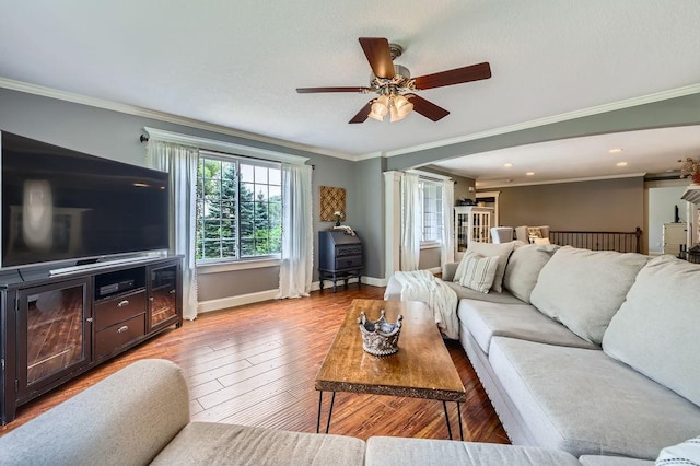 5112 Willow Ln, Minnetonka, MN 55345 - living area with ceiling fan, ornamental molding, wood finished floors, and recessed lighting