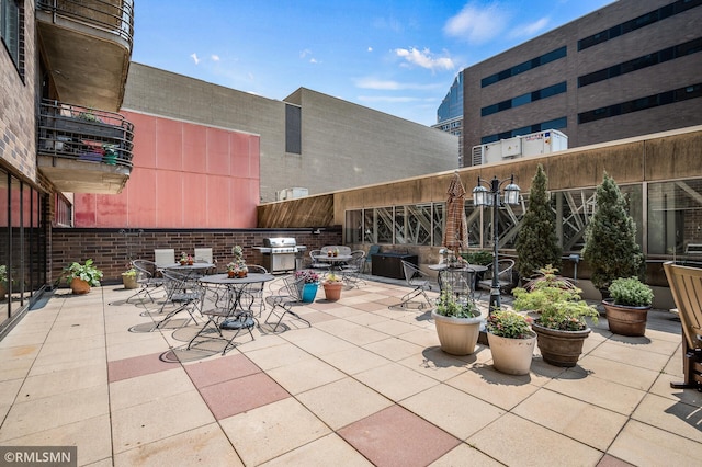 26 10th St W Unit 1409, Saint Paul, MN 55102 - view of patio with area for grilling and outdoor dining area