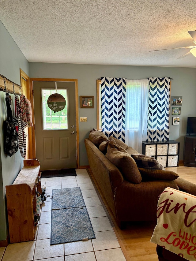 24080 Washington Dr, Osage, MN 56570 - foyer featuring a textured ceiling and ceiling fan