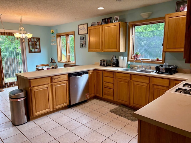 24080 Washington Dr, Osage, MN 56570 - kitchen featuring stainless steel dishwasher, a sink, a peninsula, a chandelier, and light countertops