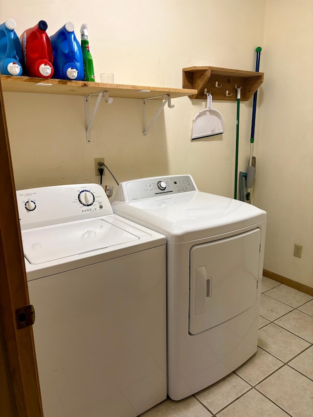 24080 Washington Dr, Osage, MN 56570 - laundry area with separate washer and dryer and light tile patterned flooring