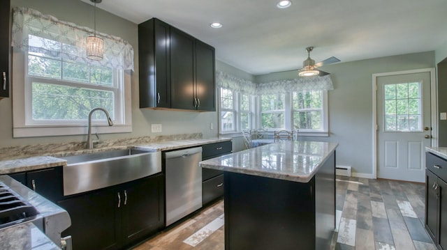 603 15th St SE, Menomonie, WI 54751 - kitchen featuring dishwasher, a sink, light stone counters, a center island, and recessed lighting