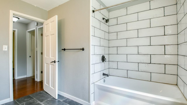 603 15th St SE, Menomonie, WI 54751 - full bathroom featuring baseboards and bathing tub / shower combination