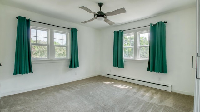 603 15th St SE, Menomonie, WI 54751 - carpeted spare room with a baseboard heating unit, a ceiling fan, and baseboards