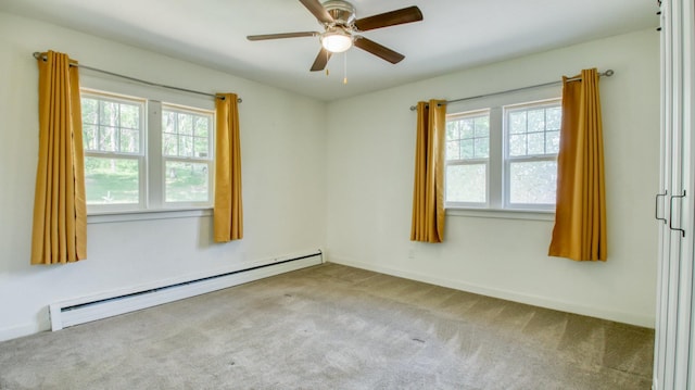 603 15th St SE, Menomonie, WI 54751 - empty room featuring baseboard heating, plenty of natural light, and carpet