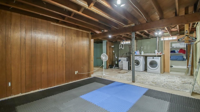 603 15th St SE, Menomonie, WI 54751 - unfinished basement featuring washer and clothes dryer and wood walls
