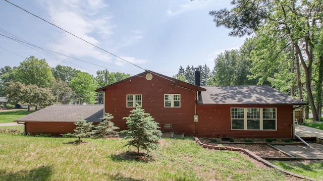 603 15th St SE, Menomonie, WI 54751 - back of property with a yard and a shingled roof