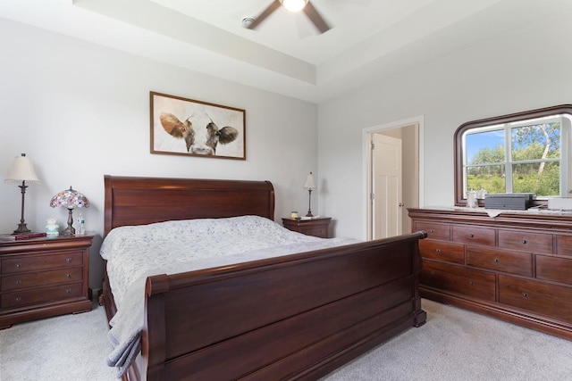 15730 Goodview Trl N, Hugo, MN 55038 - bedroom with light colored carpet, a tray ceiling, and a ceiling fan