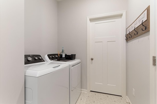 15730 Goodview Trl N, Hugo, MN 55038 - laundry room with washer and clothes dryer and baseboards