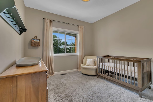 23974 185th St NW, Orrock Twp, MN 55309 - carpeted bedroom with baseboards and a nursery area