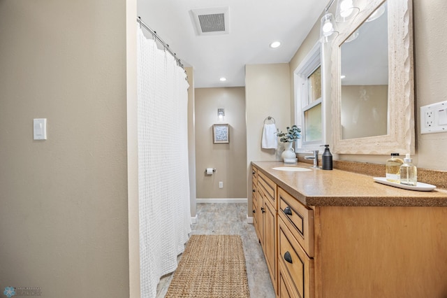 2702 2nd St N, Fargo, ND 58102 - full bath with vanity, curtained shower, and recessed lighting