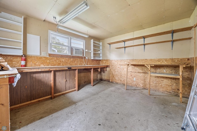 2702 2nd St N, Fargo, ND 58102 - misc room with concrete floors, cooling unit, and a workshop area