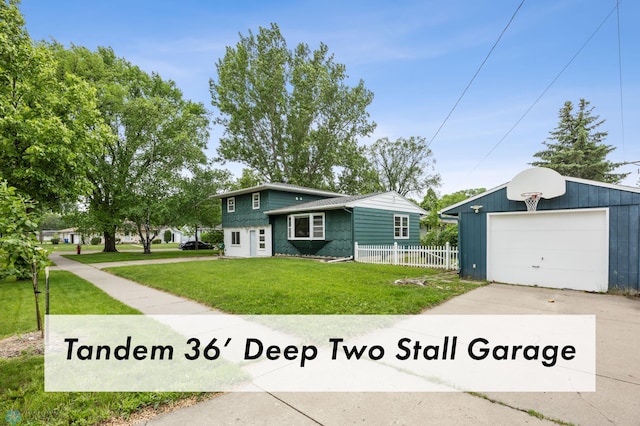 2702 2nd St N, Fargo, ND 58102 - tri-level home featuring a detached garage, an outdoor structure, and concrete driveway