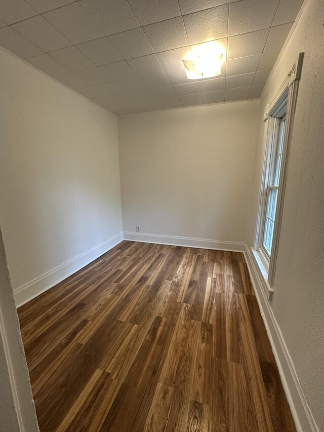 501 River St, Colfax, WI 54730 - empty room with dark wood finished floors and baseboards