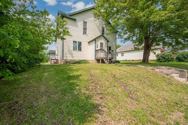 11 1st St, Nashwauk, MN 55769 - back of property with a lawn