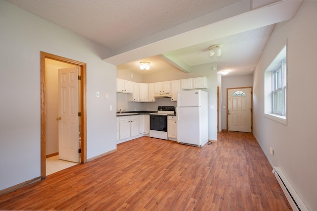 11 1st St, Nashwauk, MN 55769 - kitchen featuring freestanding refrigerator, range with electric stovetop, baseboard heating, light wood-type flooring, and white cabinets