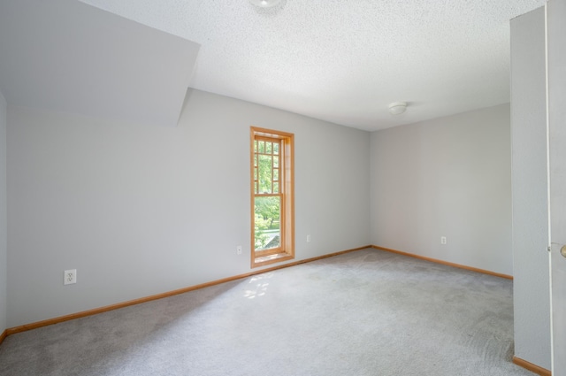 11 1st St, Nashwauk, MN 55769 - carpeted empty room featuring baseboards and a textured ceiling